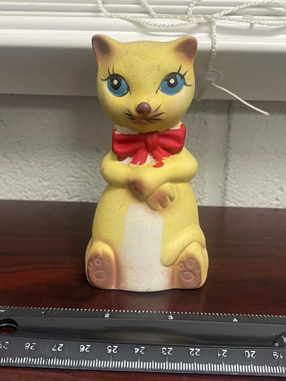 Vintage Ceramic Yellow Cat Figurine with Blue Eyes and Red Bow Tie Bell